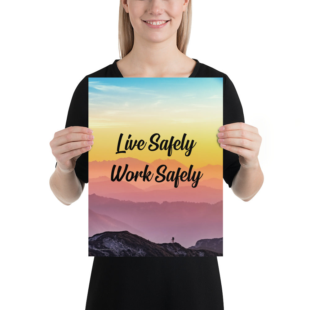 A safety poster showing a mountain range with a beautiful gradient in the sky of blue, yellow, and pink with the safety slogan "Live Safely Work Safely."