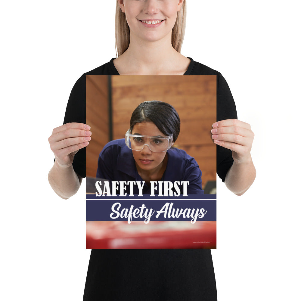 A safety poster showing a woman in safety glasses working in a woodshop with the slogan "Safety first, safety always" below her.