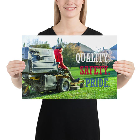 A workplace safety poster showing a man mowing a lawn on a sitting mower with the words quality, safety, pride in white, red, and blue, respectively.
