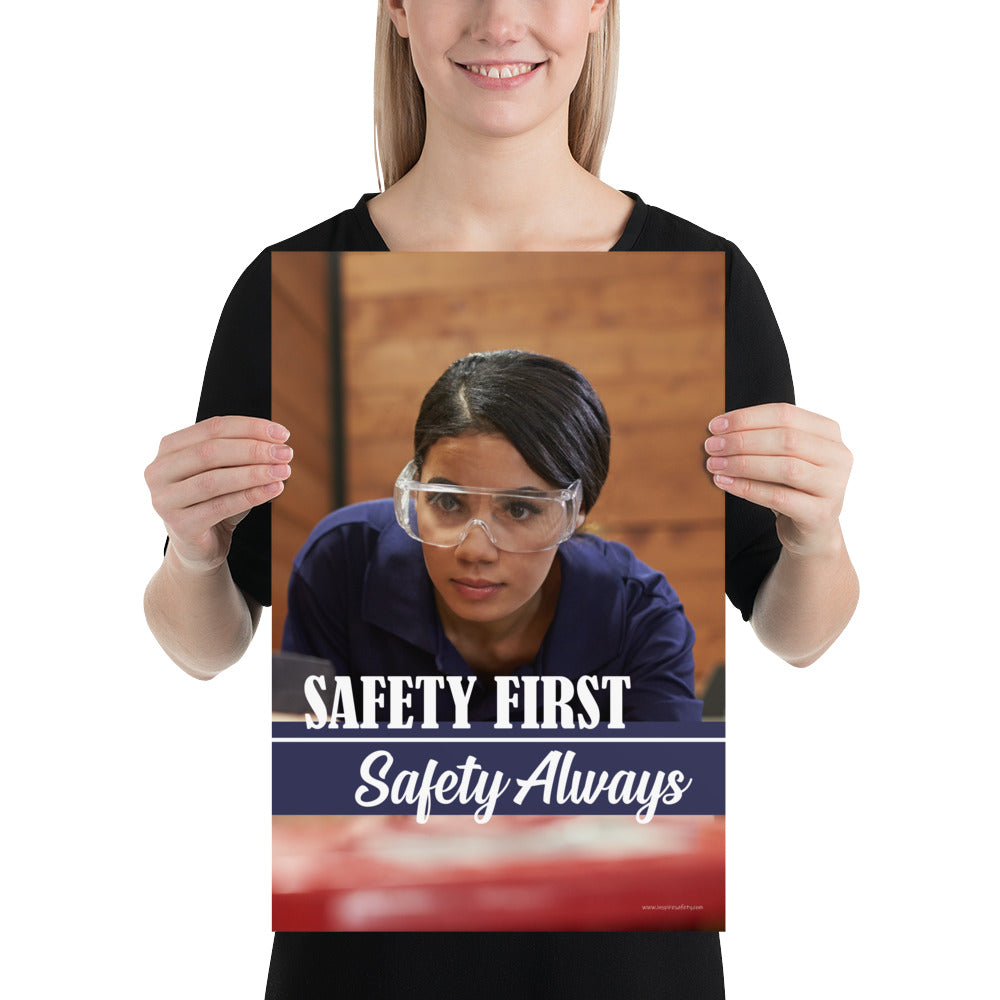A safety poster showing a woman in safety glasses working in a woodshop with the slogan "Safety first, safety always" below her.