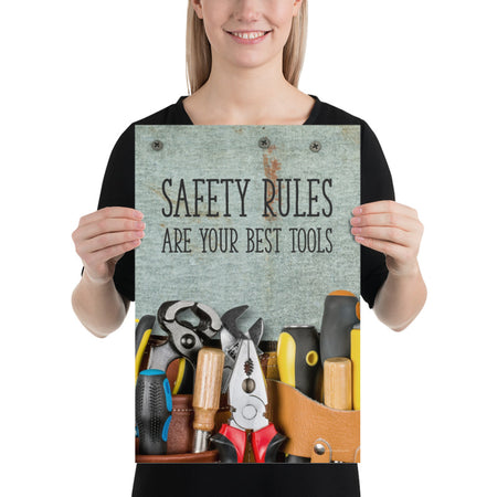 A safety poster showing various tools including screwdrivers, pliers, and wrenches laying on a worktable with the slogan safety rules are your best tools.