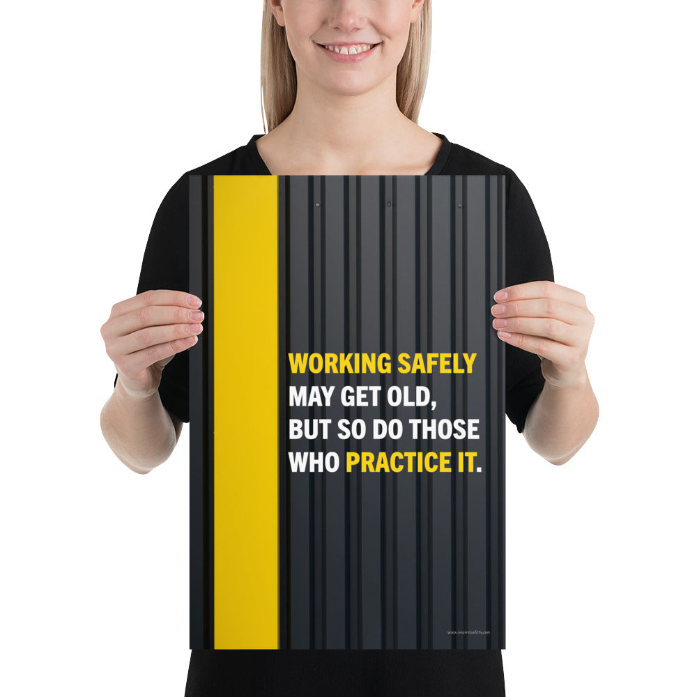 A construction safety poster showing a black metal wall with a yellow stripe with the slogan "Working safely may get old, but so do those who practice it."