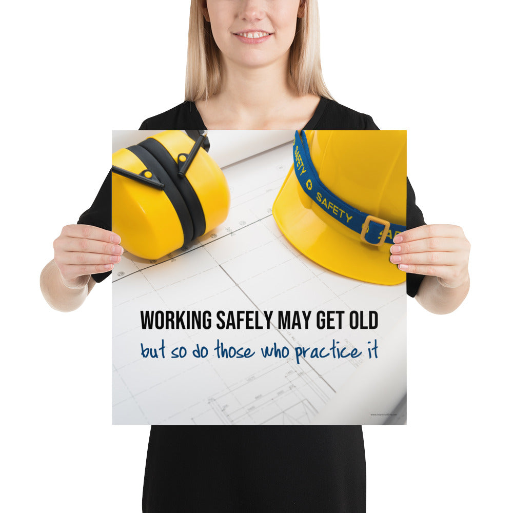 A construction safety poster showing yellow ear muffs and a hard hat resting on blueprints with the slogan "Working safely may get old, but so do those who practice it."