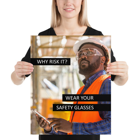 A safety poster showing a man in a reflective vest, hard hat, and safety glasses working with the slogan "Why risk it? Wear your safety glasses."