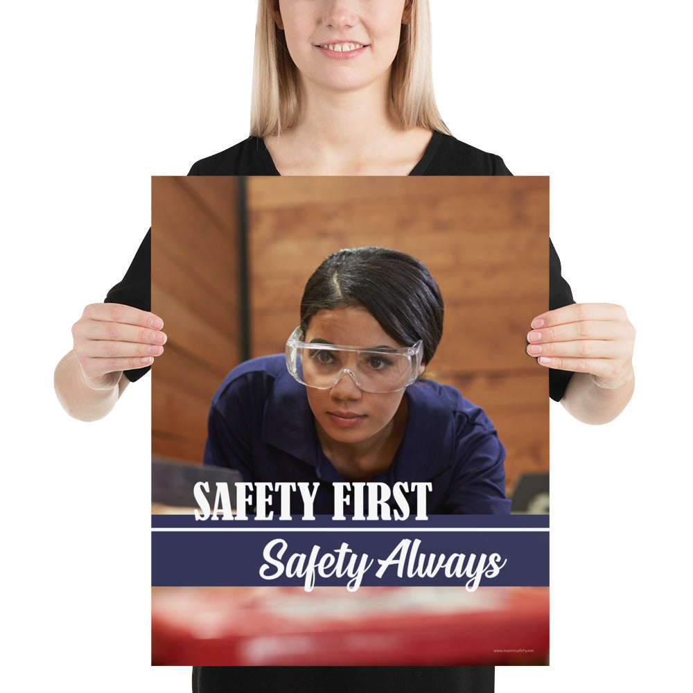 A safety poster showing a woman in safety glasses working in a woodshop with the slogan "Safety first, safety always" below her.