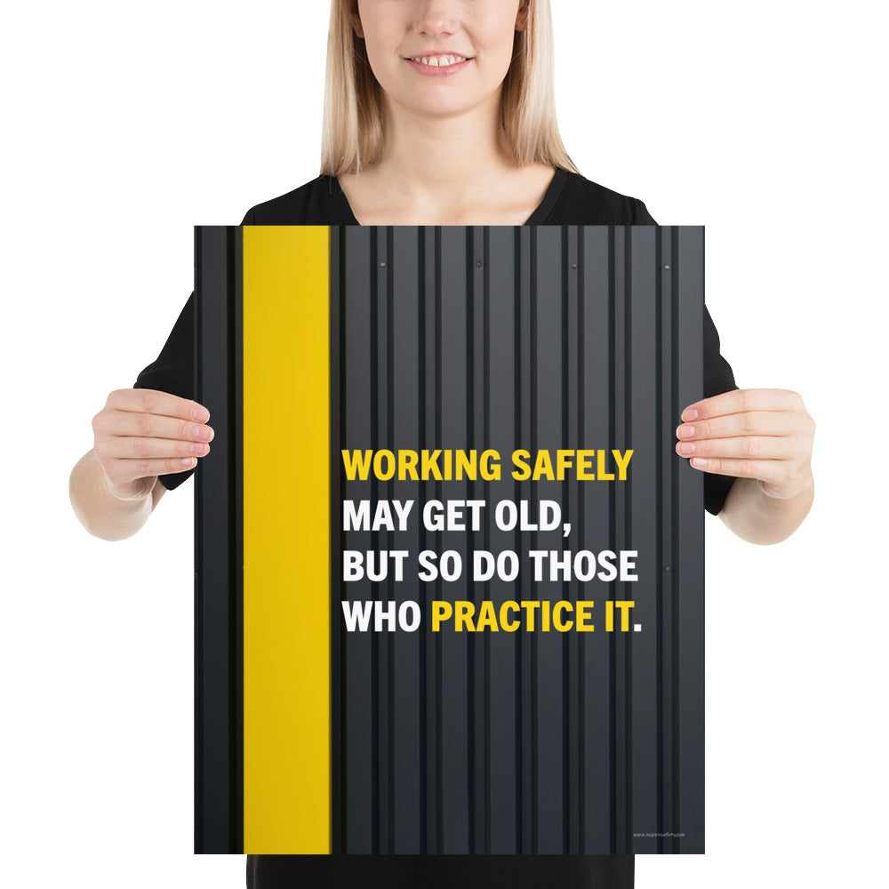 A construction safety poster showing a black metal wall with a yellow stripe with the slogan "Working safely may get old, but so do those who practice it."