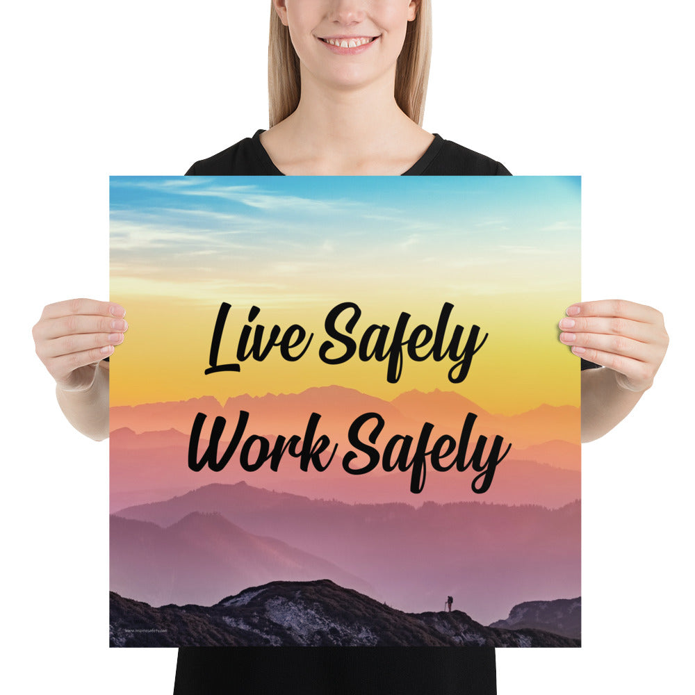 A safety poster showing a mountain range with a beautiful gradient in the sky of blue, yellow, and pink with the safety slogan "Live Safely Work Safely."