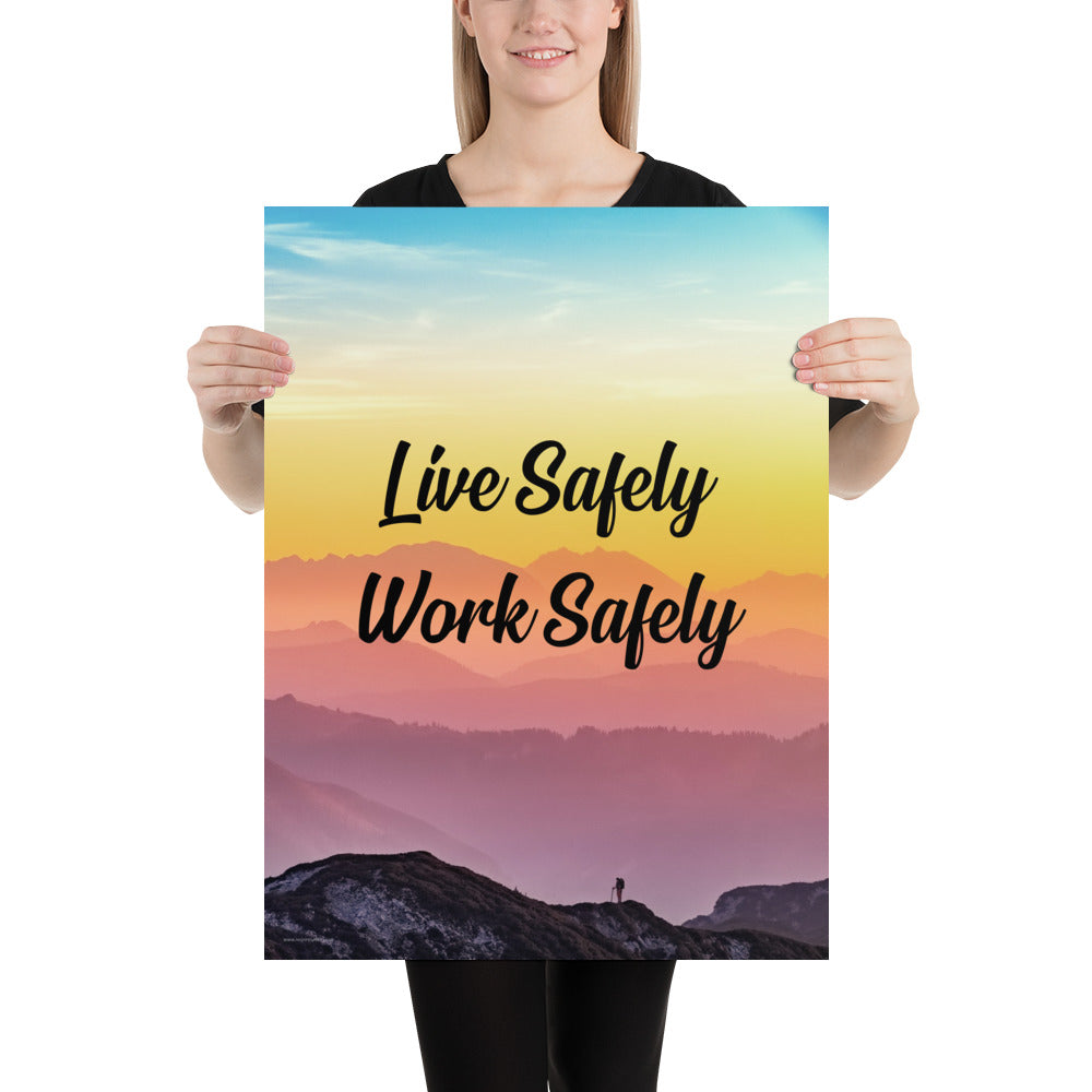 A safety poster showing a mountain range with a beautiful gradient in the sky of blue, yellow, and pink with the safety slogan "Live Safely Work Safely."
