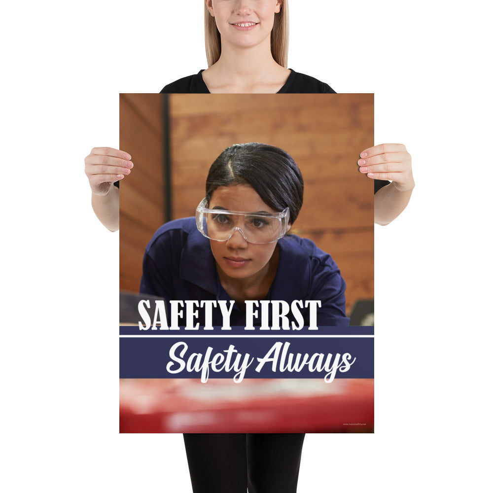 A safety poster showing a woman in safety glasses working in a woodshop with the slogan "Safety first, safety always" below her.