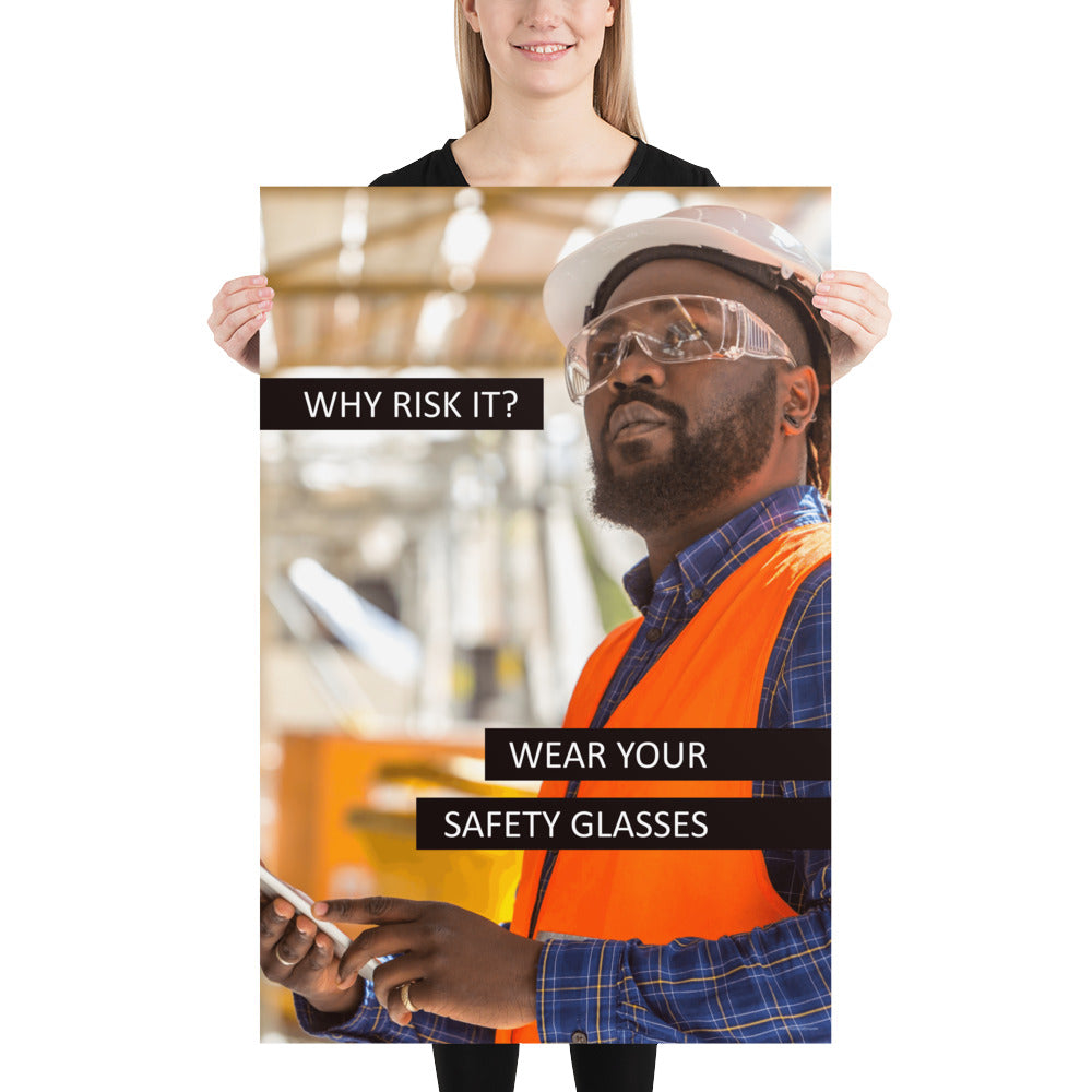 A safety poster showing a man in a reflective vest, hard hat, and safety glasses working with the slogan "Why risk it? Wear your safety glasses."