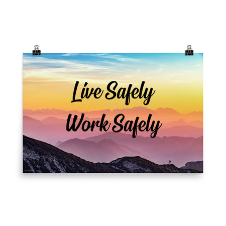 A safety poster showing a mountain range with a beautiful gradient in the sky of blue, yellow, and pink with the safety slogan "Live Safely Work Safely."