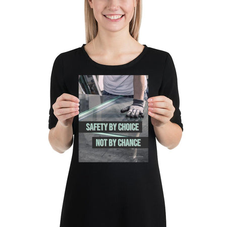 A workplace safety poster showing a close-up of a worker's hands grabbing panes of glass with gloves on with the slogan safety by choice not by chance.