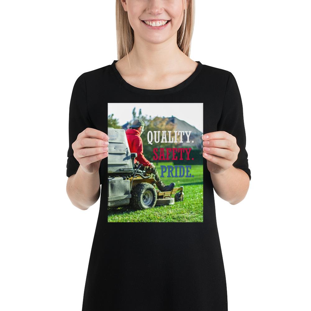 A workplace safety poster showing a man mowing a lawn on a sitting mower with the words quality, safety, pride in white, red, and blue, respectively.
