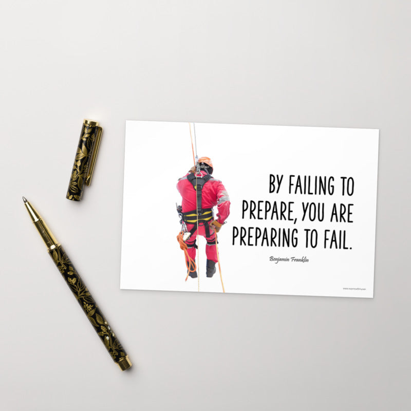 A safety print showing a person in full fall protection gear with a quote by Ben Franklin that says "By failing to prepare, you are preparing to fail."