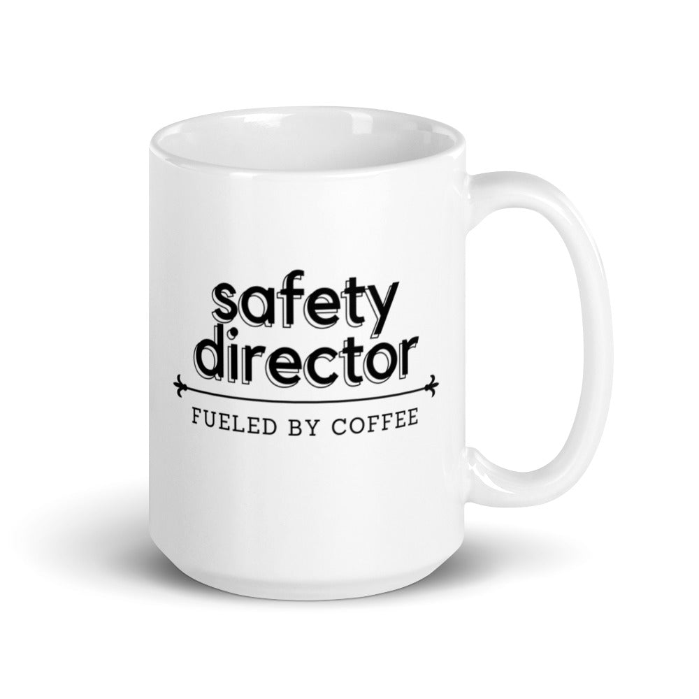 White ceramic mug with the phrase "Safety Director, fueled by coffee."