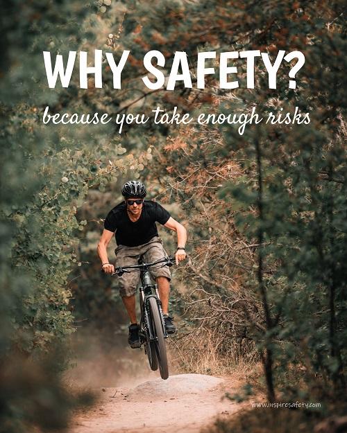 A workplace safety poster showing a man dirt biking on a forest trail with the slogan why safety? because you take enough risks.