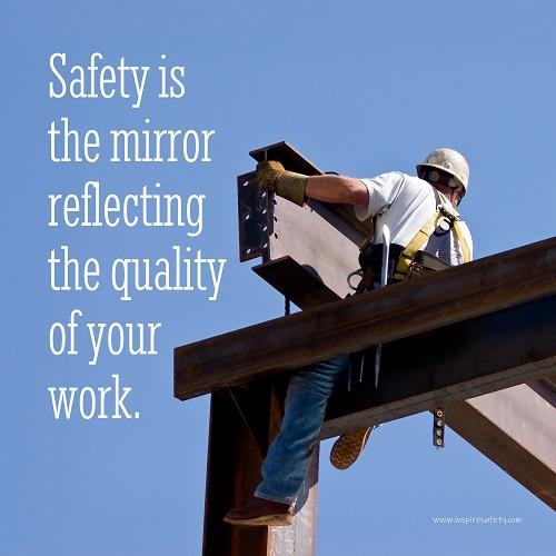 A workplace safety poster showing a construction ironworker on steel beams in a hardhat and safety harness with a bright blue sky in the background with the slogan safety is the mirror reflecting the quality of your work.