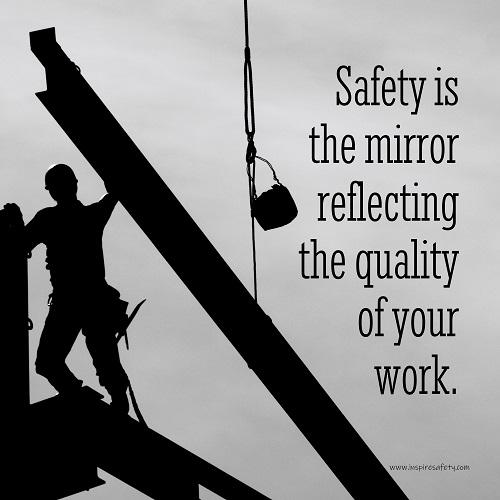 A workplace safety poster showing a construction ironworker working on a construction site with everything silhouetted black with a light grey background and with the slogan safety is the mirror reflecting the quality of your work.