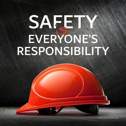 A workplace safety poster showing a red hard hat in front of a grey, industrial-looking background with the slogan safety is everyone's responsibility.