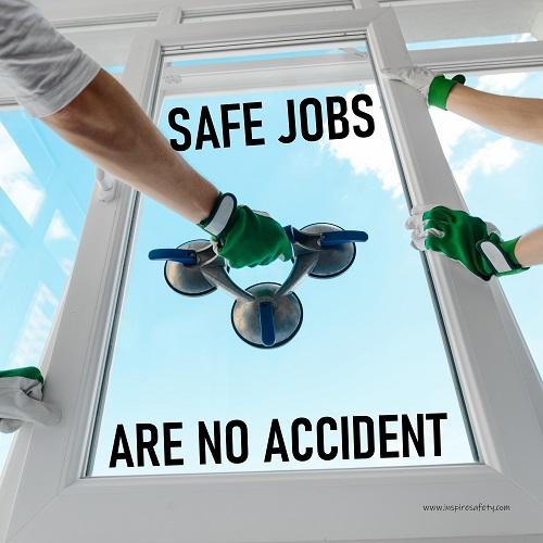 A workplace safety poster showing a close-up of two worker's hands wearing gloves while installing windows with the slogan safe jobs are no accident.