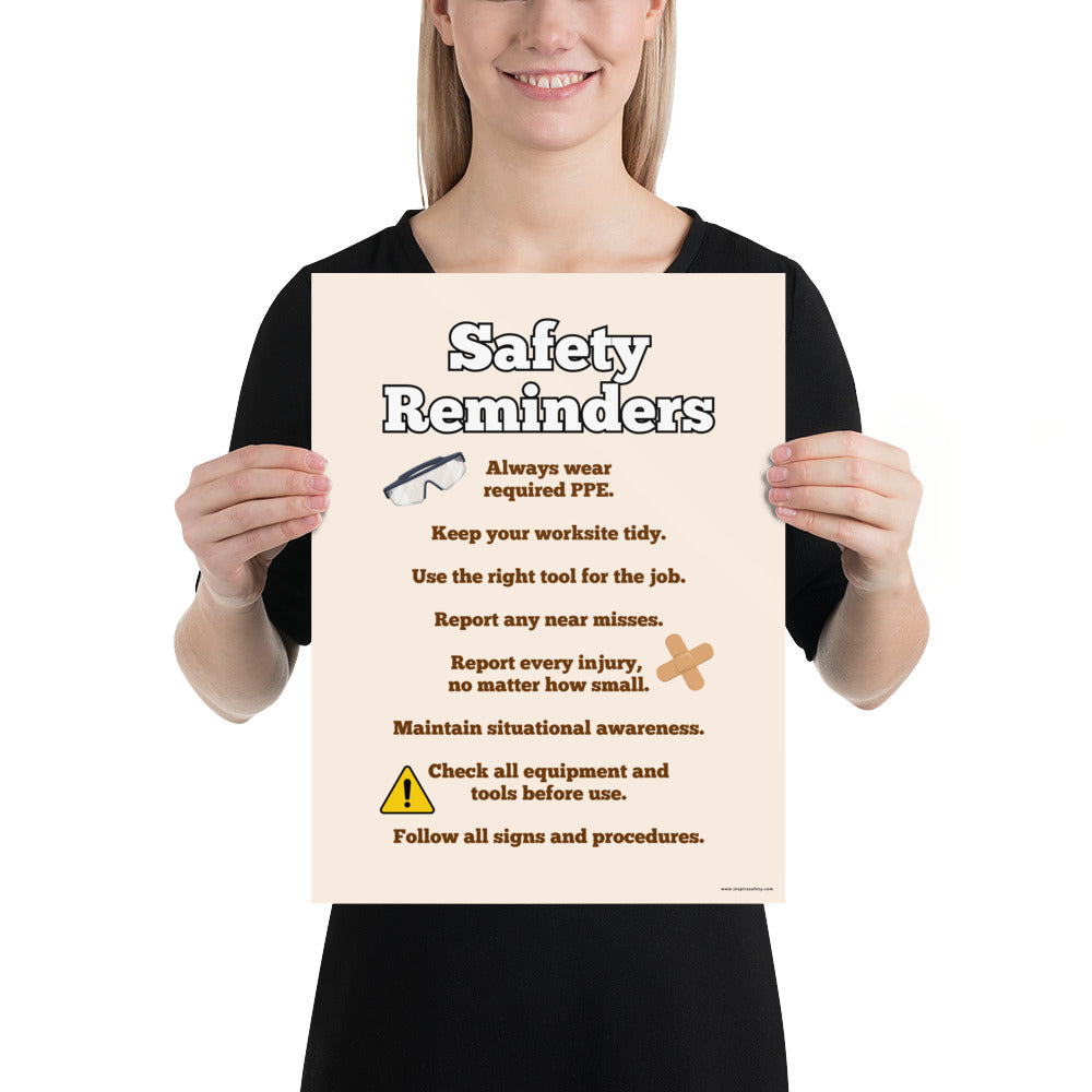 A workplace safety poster with a light tan background and large text saying "Safety Reminders" with a list underneath it of various workplace safety tips.