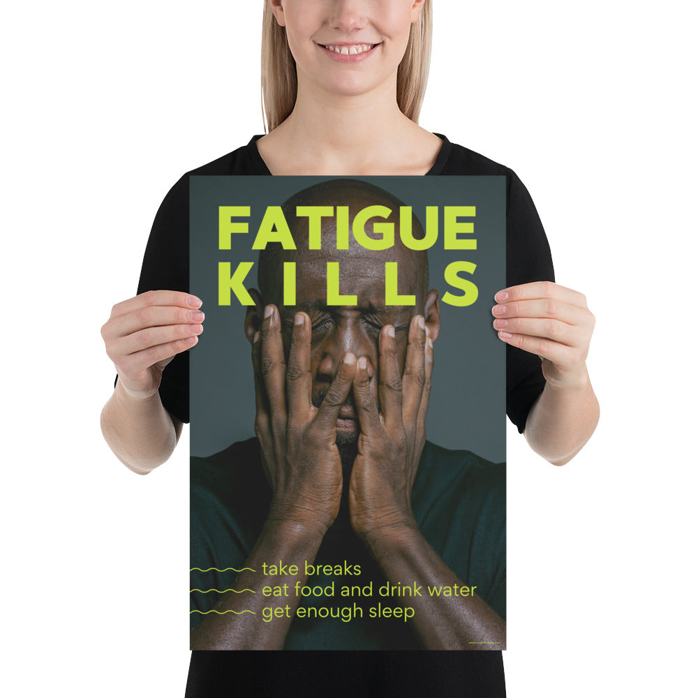 A workplace safety poster showing a black man with his face in his hands with large neon text saying "Fatigue Kills."