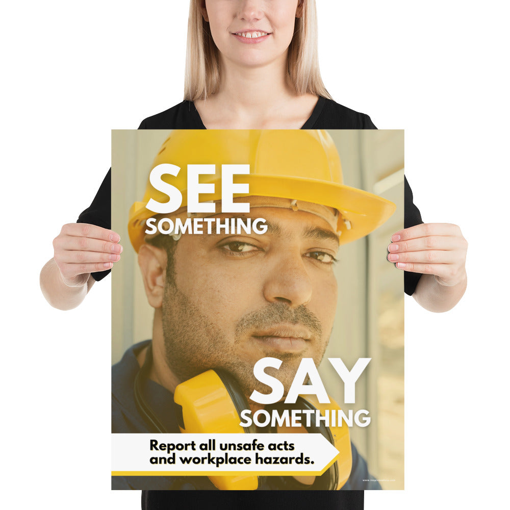 A workplace safety poster showing a solemn man's face wearing a hard hat with the words "See Something, Say Something" with a small banner at the bottom that says "Report all unsafe acts and workplace hazards."