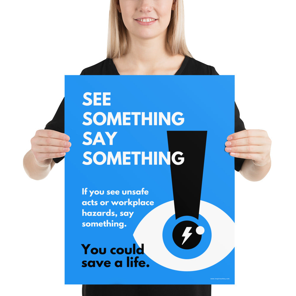 A workplace safety poster with a bright blue background an an eye with an exclamation point coming from the pupil and a lightning bolt in the middle of the pupil with text that says "See Something Say Something" in bold lettering with the words "If you see unsafe acts or workplace hazards, say something. You could save a life."