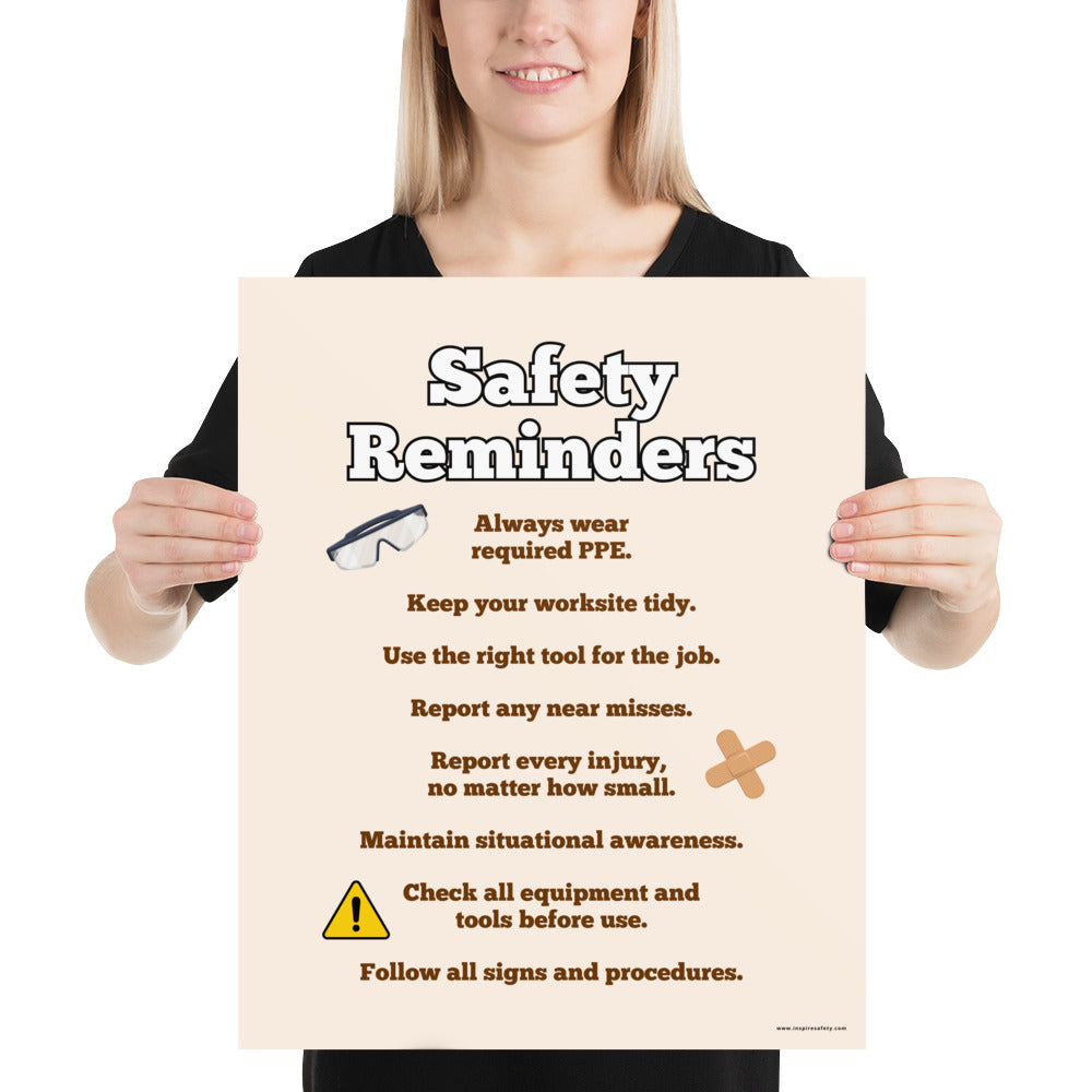 A workplace safety poster with a light tan background and large text saying "Safety Reminders" with a list underneath it of various workplace safety tips.