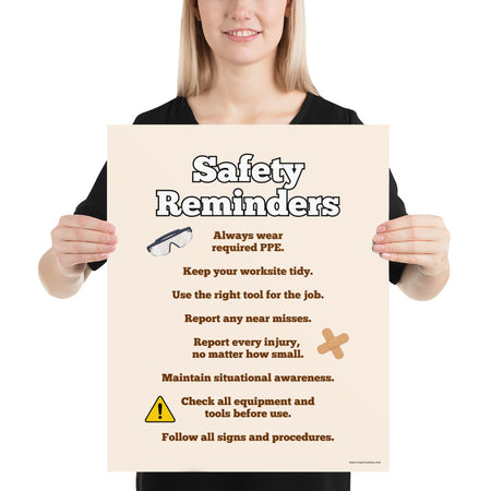 A workplace safety poster with a light tan background and large text saying "Safety Reminders" with a list underneath it of various workplace safety tips.