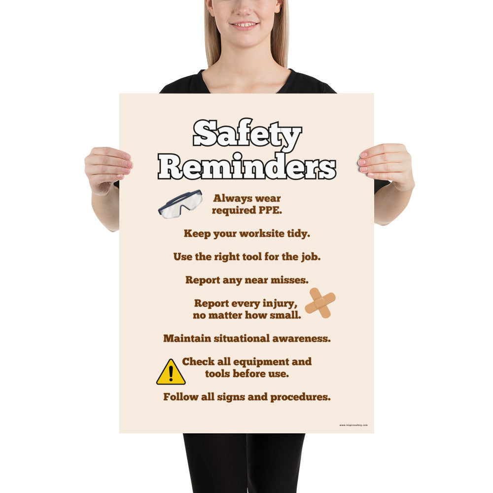 A workplace safety poster with a light tan background and large text saying "Safety Reminders" with a list underneath it of various workplace safety tips.