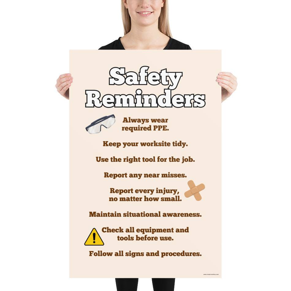 A workplace safety poster with a light tan background and large text saying "Safety Reminders" with a list underneath it of various workplace safety tips.