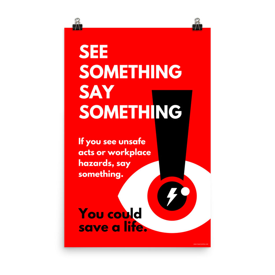 A workplace safety poster with a bright red background an an eye with an exclamation point coming from the pupil and a lightning bolt in the middle of the pupil with text that says "See Something Say Something" in bold lettering with the words "If you see unsafe acts or workplace hazards, say something. You could save a life."