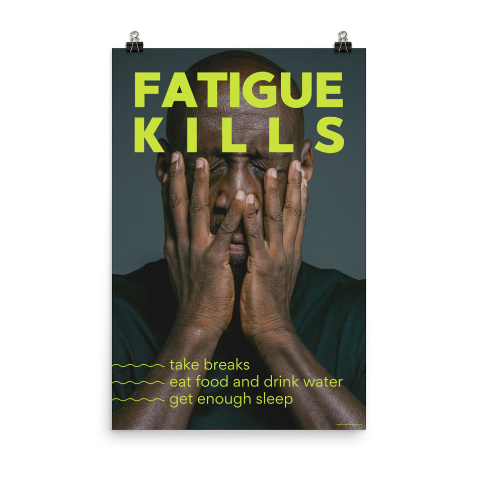 A workplace safety poster showing a black man with his face in his hands with large neon text saying "Fatigue Kills."