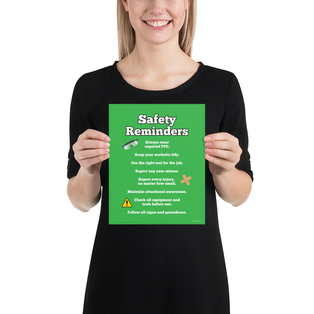 An workplace safety poster with a bright green background and large text saying "Safety Reminders" with a list underneath it of various workplace safety tips.