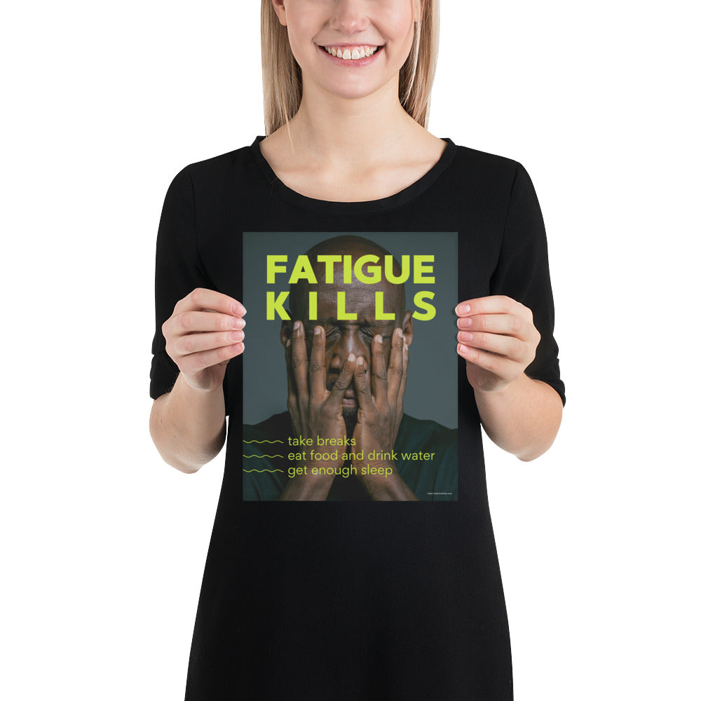 A workplace safety poster showing a black man with his face in his hands with large neon text saying "Fatigue Kills."