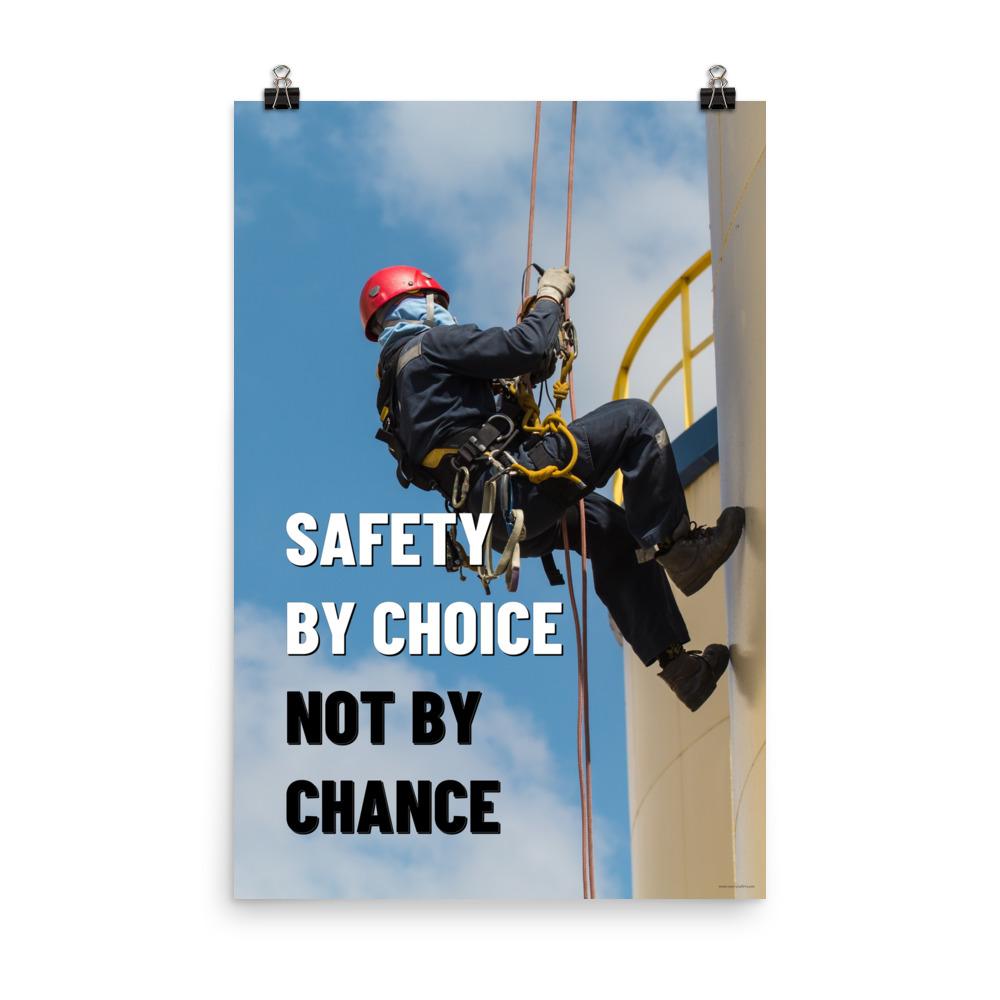 A fully harnessed man wearing a hard hat scaling the side of a building with a bright blue sky and clouds in the background with the text safety by choice, not by chance in bold text to his left.