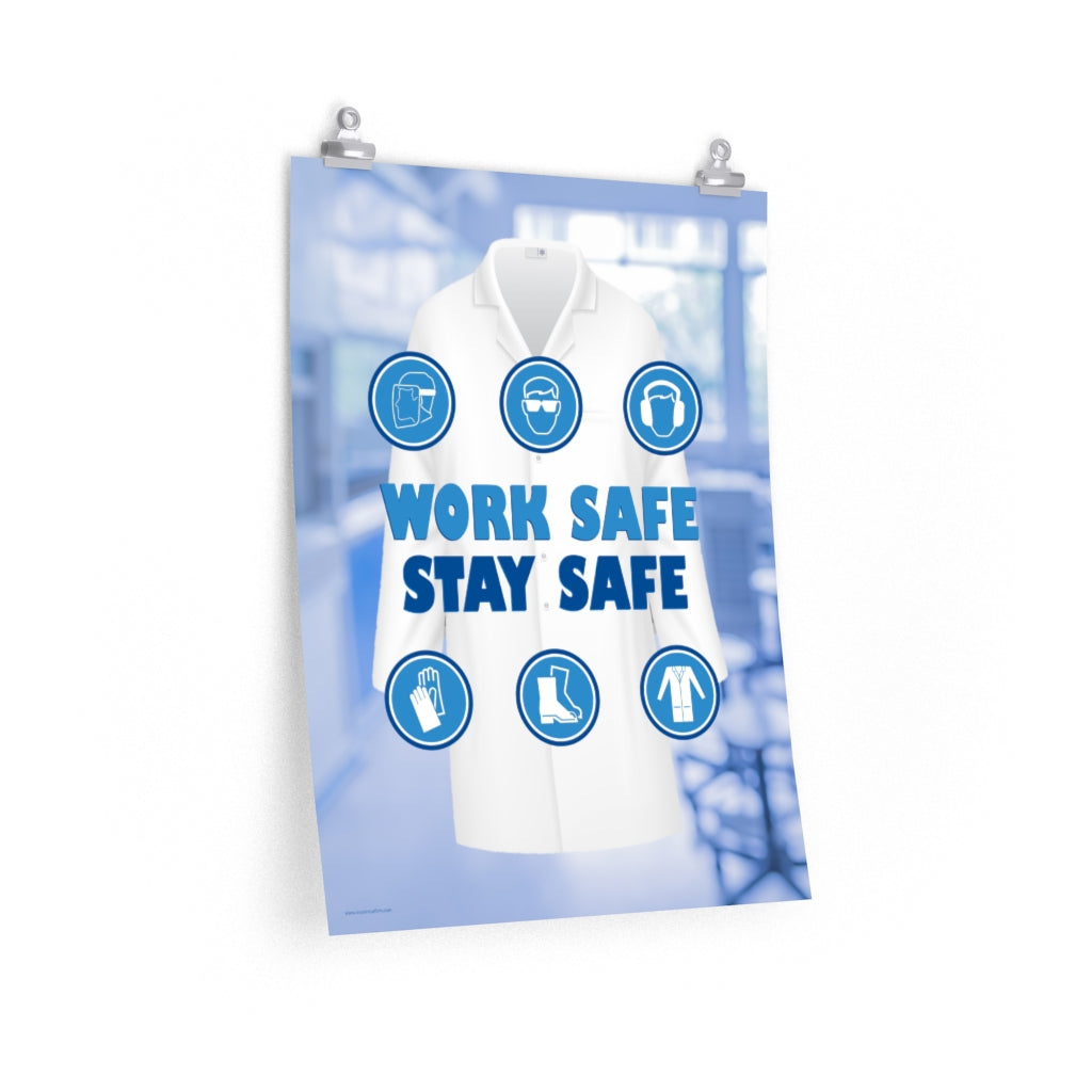 A workplace safety poster showing a blurred blue tinted lab in the background with a bright white lab coat and different blue infographic bubbles of PPE around the slogan work safe, stay safe.