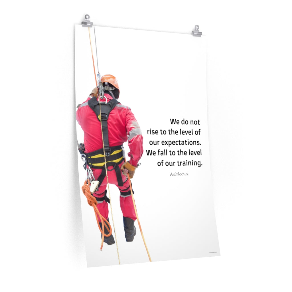 A safety poster showing a worker performing a controlled descent while wearing a fall protection harness on a bright white background with a quote from Archilochus to the right.