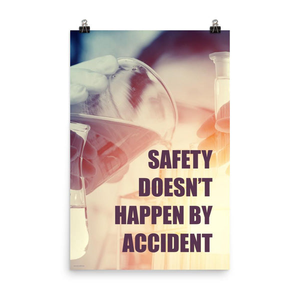 Safety poster showing a close up of 3 hands wearing gloves holding glass beakers and a safety slogan that says "Safety doesn't happen by accident" written in bottom right corner.