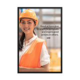 Safety poster showing a female warehouse worker smiling and wearing an orange reflective safety vest and orange hard hat with a safety quote written in dark text.