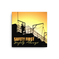 A workplace safety poster showing a construction site and construction workers being silhouetted by a bright and beautiful sunset of different shades of orange with the slogan safety first, safety always.