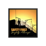 A workplace safety poster showing a construction site and construction workers being silhouetted by a bright and beautiful sunset of different shades of orange with the slogan safety first, safety always.