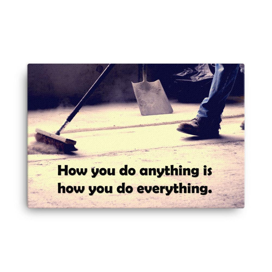 Safety poster showing a closeup of the ground where a warehouse or construction worker is sweeping the workshop floor and an encouraging safety slogan written in bold text.