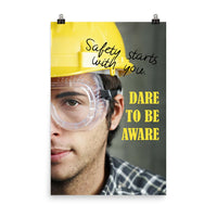 Safety poster showing a close up on half of a man's face wearing a yellow hard hat and safety glasses with text to the right.