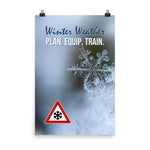 A safety poster showing a close-up of a real snowflake crystal and a hazard snow symbol in the bottom left corner with the slogan winter weather, plan, equip, train.
