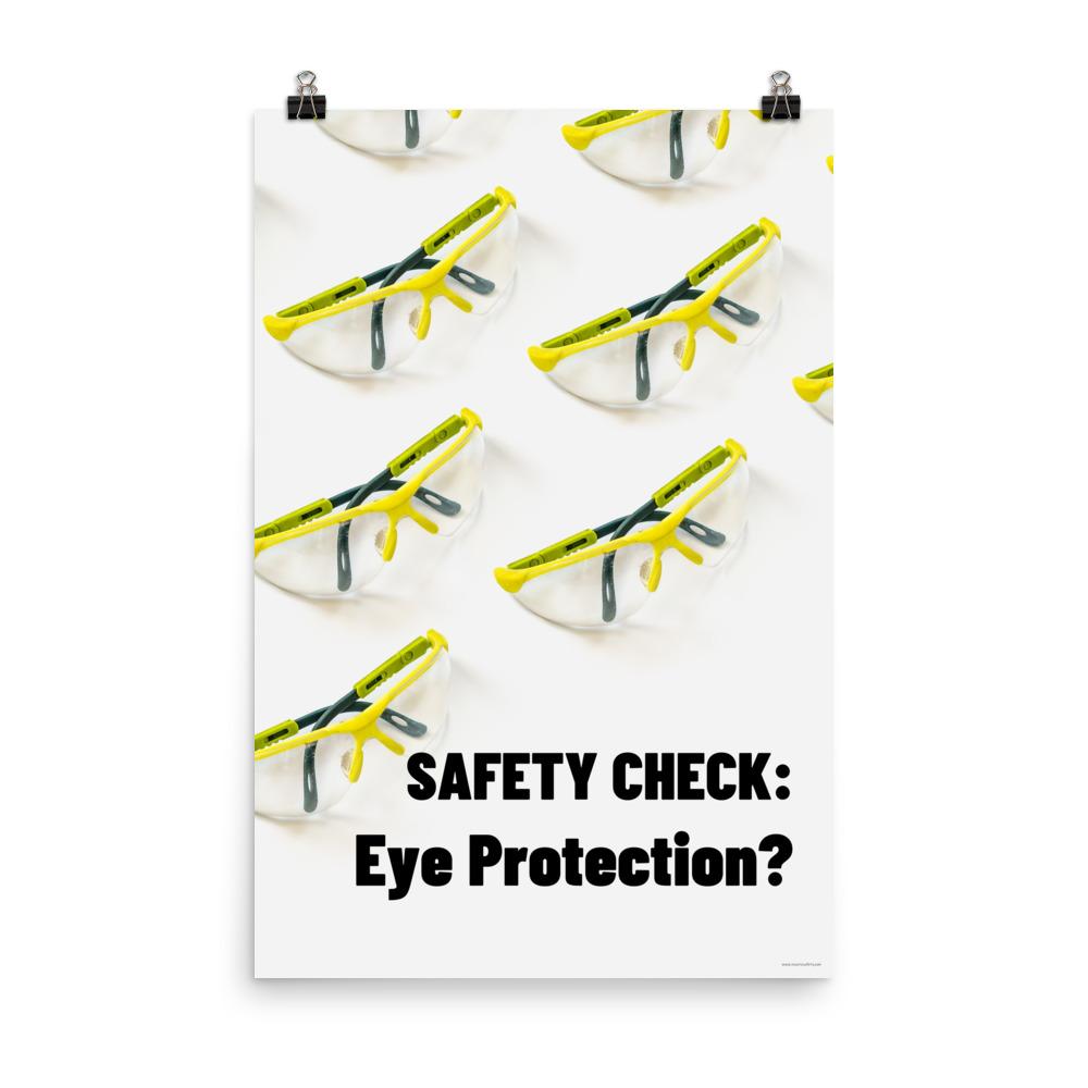 An eye safety poster depicting many clear safety glasses with yellow trim neatly lined up in rows and rows with a safety slogan in the foreground.