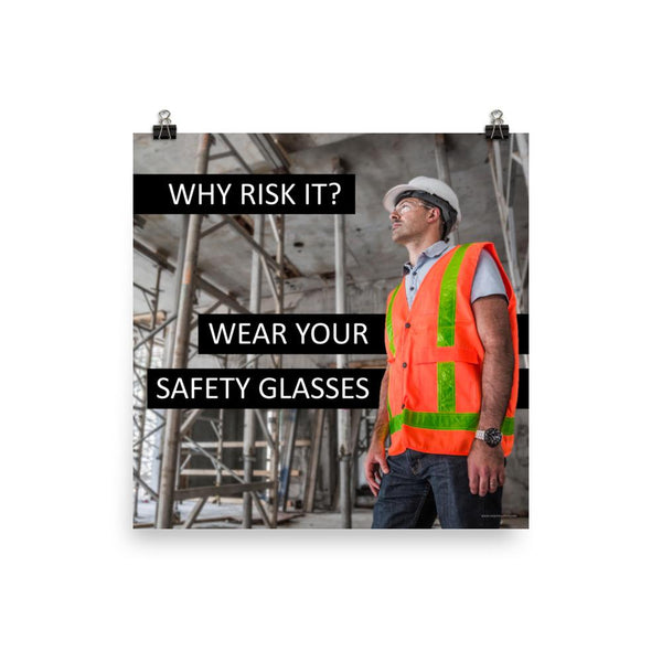 A safety poster showing a construction worker in a reflective orange vest, hard hat, and safety glasses on a construction site looking out with a safety slogan to the left.