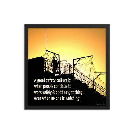 A construction safety poster showing the silhouette of a construction worker working on a building with a bright yellow sunset in the background and a safety slogan in the bottom left corner.