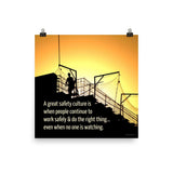 A construction safety poster showing the silhouette of a construction worker working on a building with a bright yellow sunset in the background and a safety slogan in the bottom left corner.
